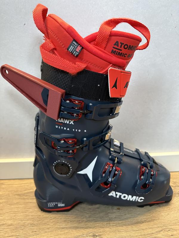 Ski boot tensioner