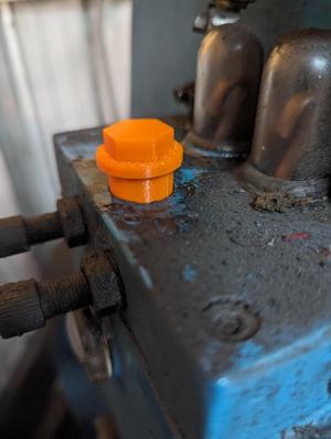 Oil stopper with breather hole