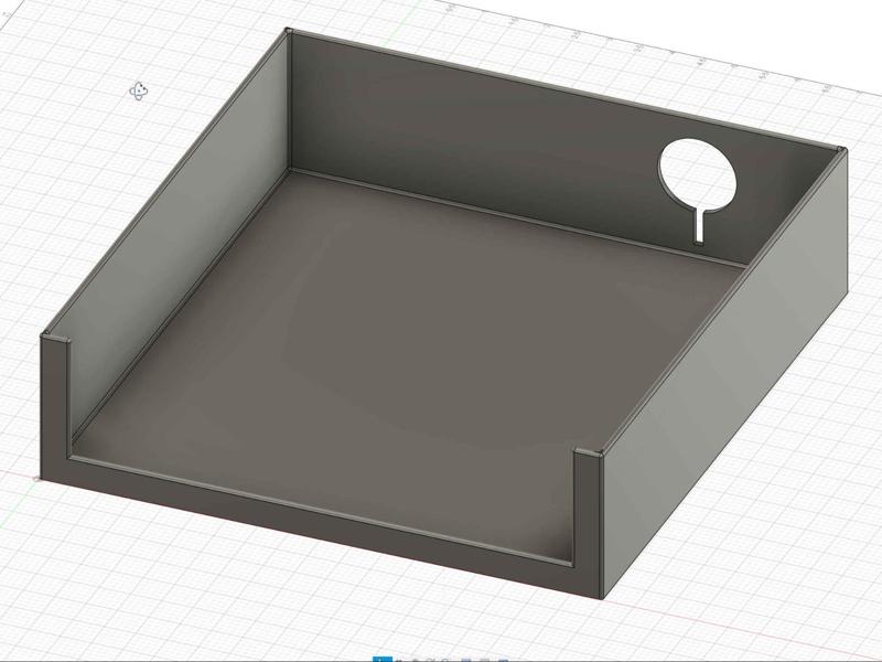 A box with a hole for charging cables.