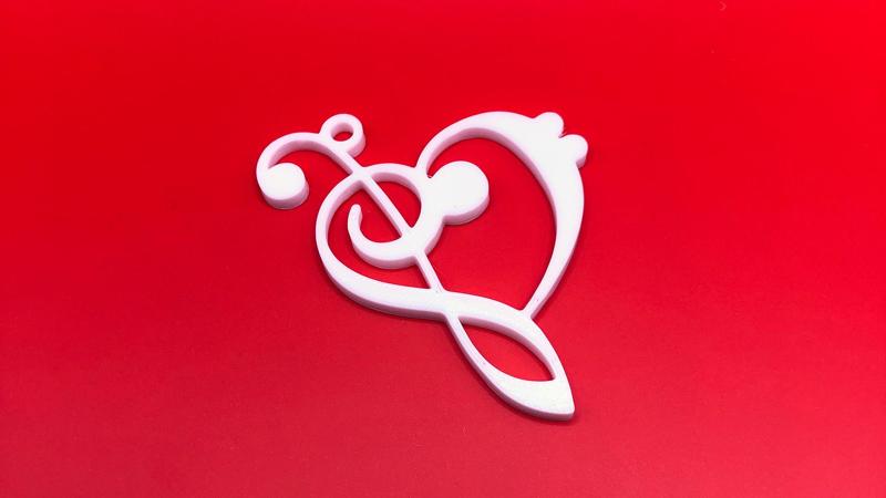 Treble and bass clef heart pendant