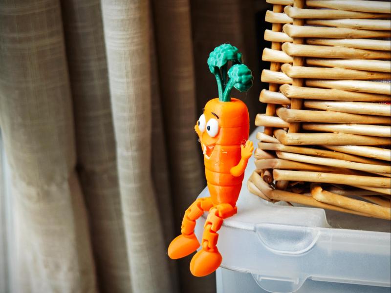 A cartoony carrot with arms and legs