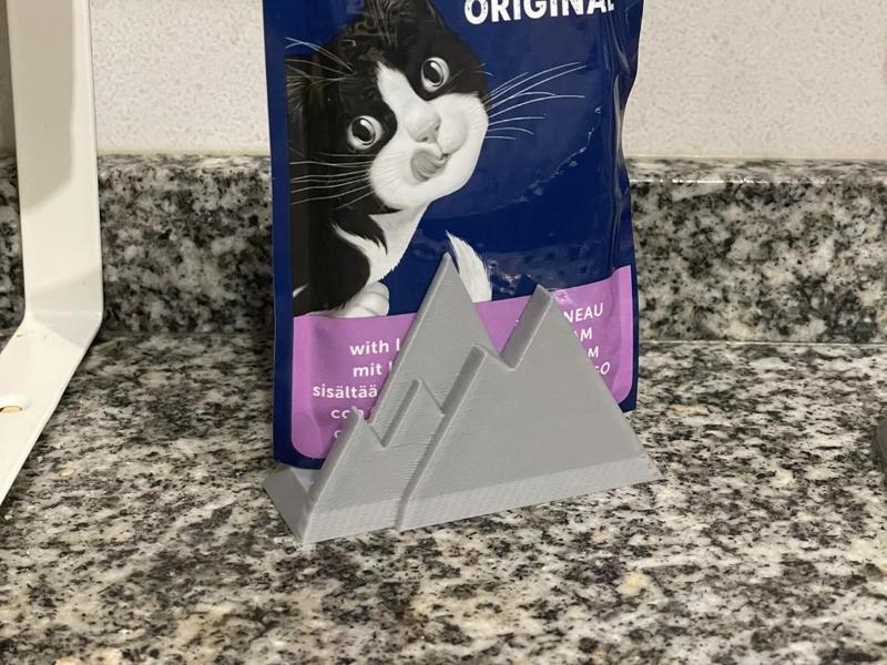 Cat food packet mountain holder