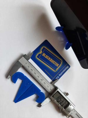 Credit card size phone holder and supermarket trolley tokens removable