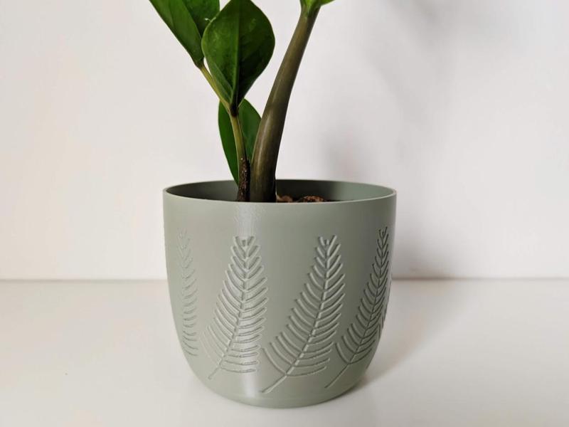 Elegant plant pot with pine detail