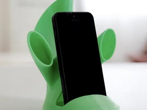 Phone stand with sound amplifier