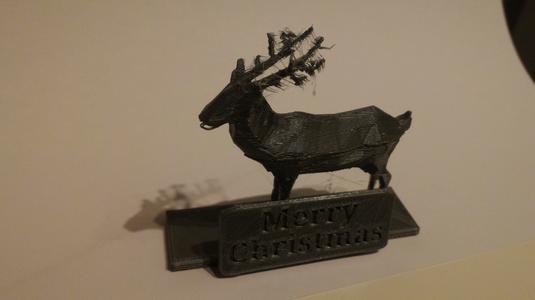 Reindeer with stand and sign