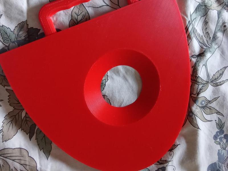 Handheld fan with central air flow hole