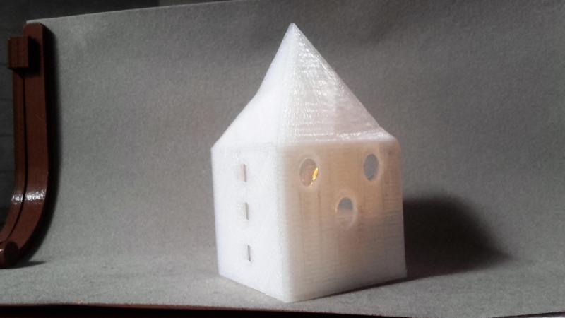 Small illuminated house