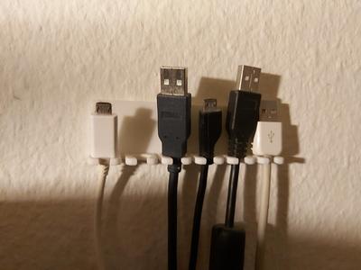 Wallmounted USB-cable holder