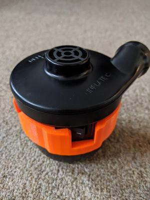 Switch guard for portable inflating pump