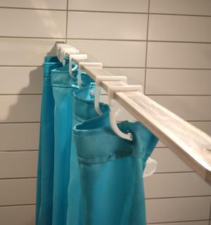 Shower curtain hanger