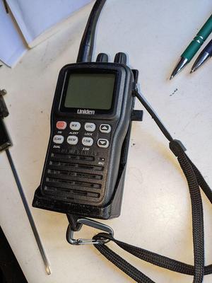 Shoulder holster for an Uniden MHS75 marine radio