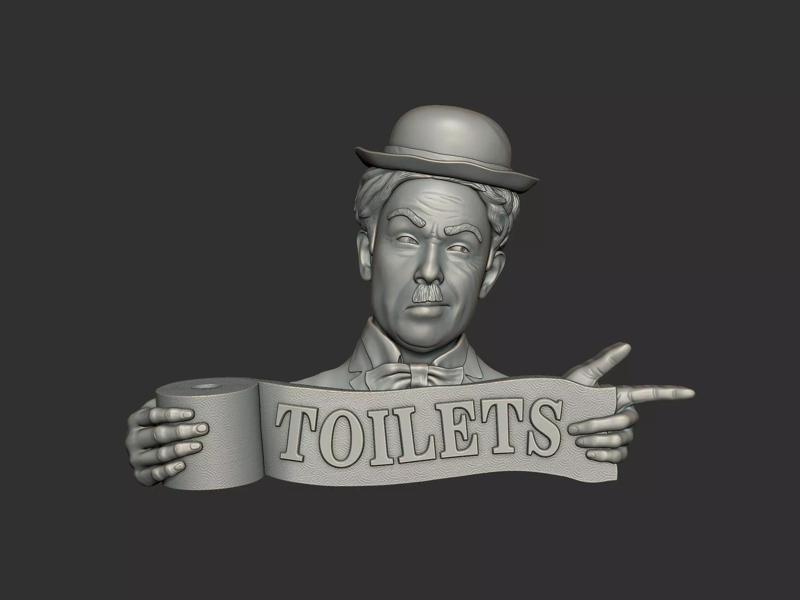 Charlie Chaplin bas relief toilet sign