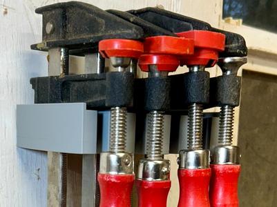 Wall mount Bessey F-style bar clamp holder