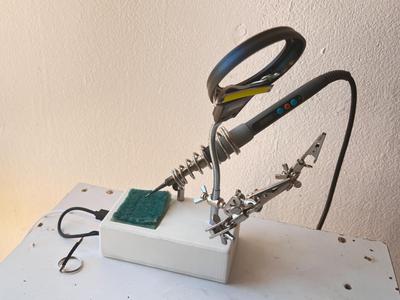 Soldering iron holder with light