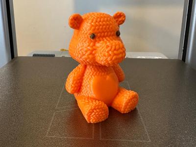 Knitted teddy with heart