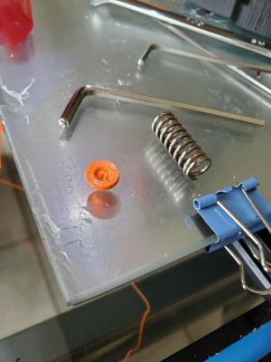 Tension spring adjustment pin