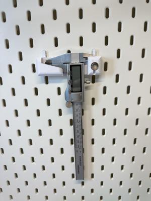 Caliper Bracket for Skadis + Battery Holder with Locking Peg Mount - Remix.