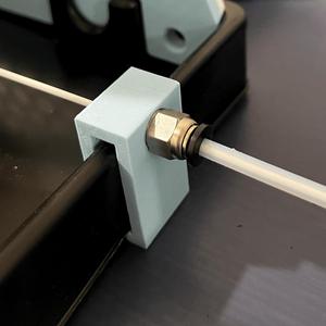 PTFE spoolholder feed clip with stopper