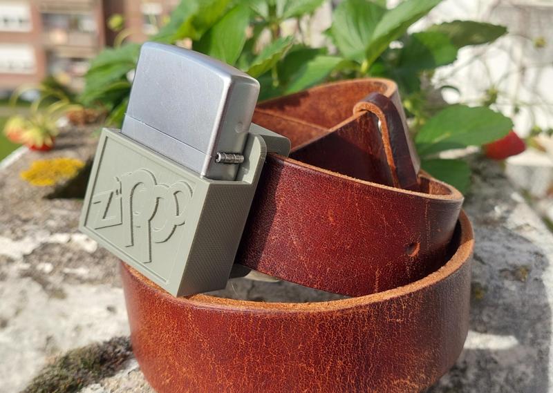 Zippo lighter holder with belt attachment.