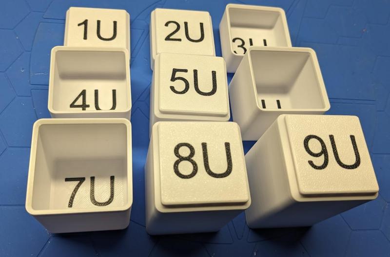 Gridfinity bins with multi-color text for testing height