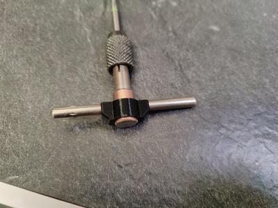 Thread tap t-handle lock