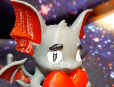 Gothic Chihuahua Bat holding a hart