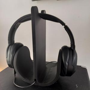 Headphone stand with integrated cable guide.