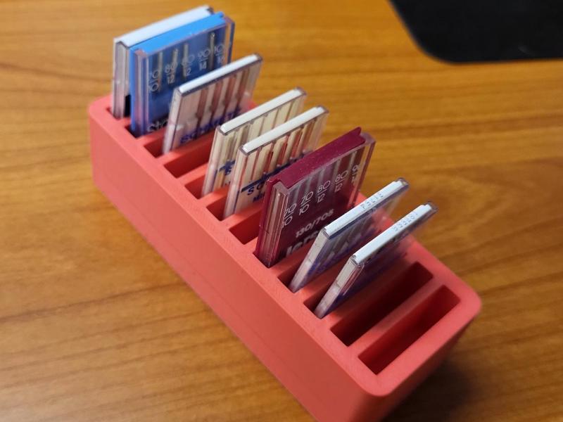 Sewing machine needle box