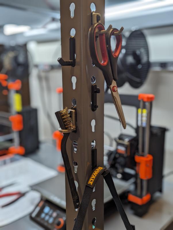 Hooks for keyhole slot shelving