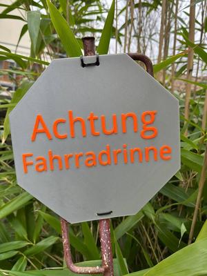 Warning sign "Achtung Fahrradrinne"