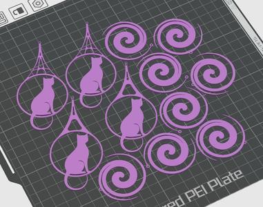 Earrings set in cat and spiral shapes