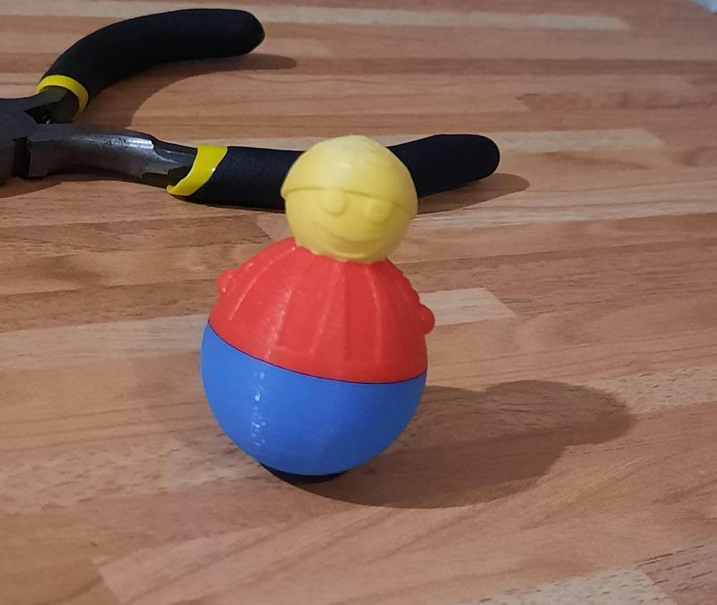 Smiling Stand-up man tumbler toy