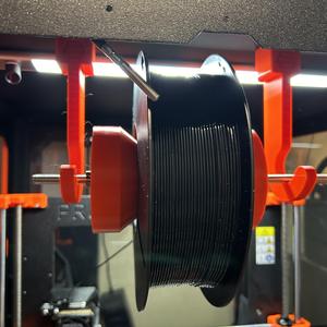 Enclosure spool hanger and smoothly rotating spool presser bar