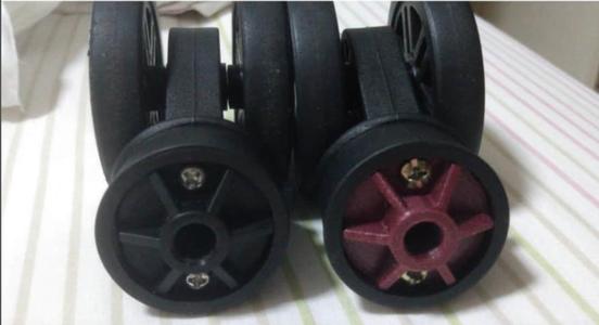 Suitcase wheel holder