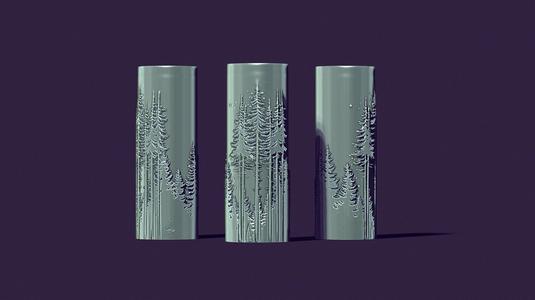 candle with a picture of fir trees