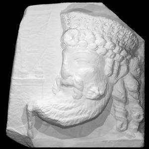 Two-sided decorative slab with masks