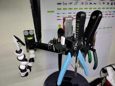 Tool holder on swing arm