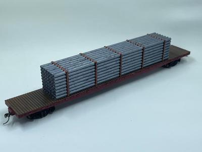 HO Scale 75ft Flatcar Freight Train car with a Pipe Load 