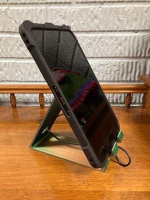 Tablet holder with access for power cord