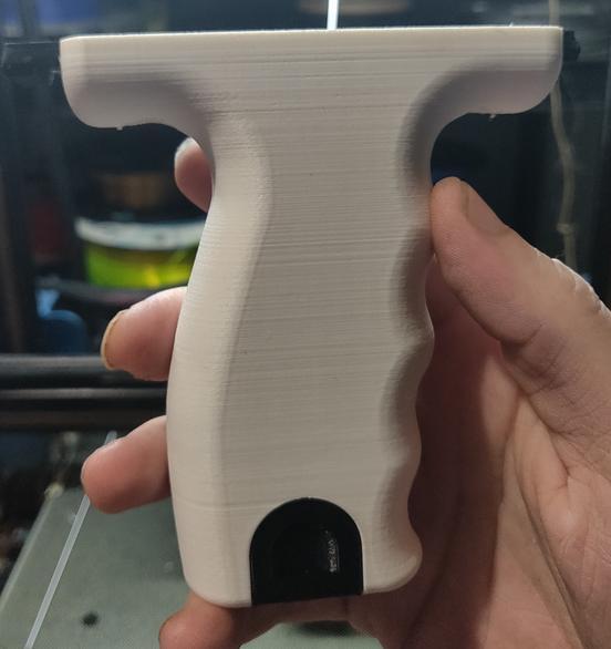 Pistol grip with storage and rail slot