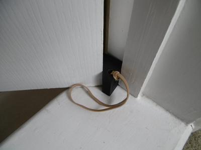 In-hinge door stop