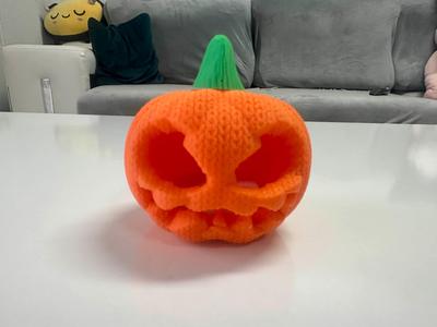 Halloween knitted pumpkin tea light
