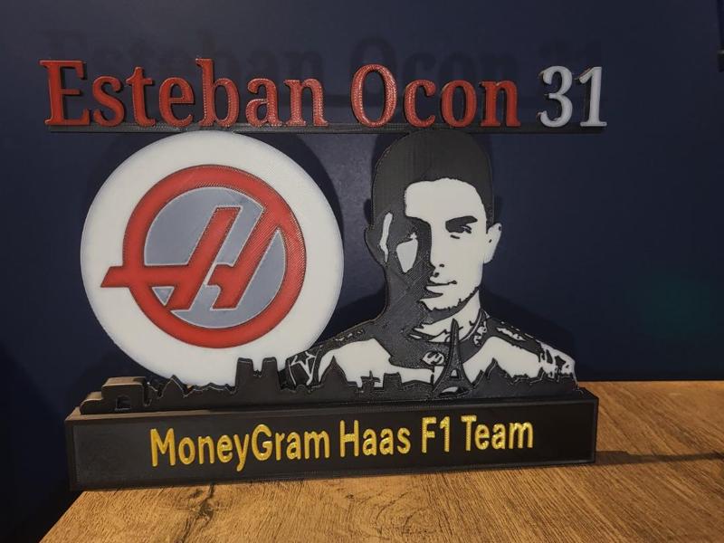 Esteban Ocon with skyline of Paris F1 Haas Racing