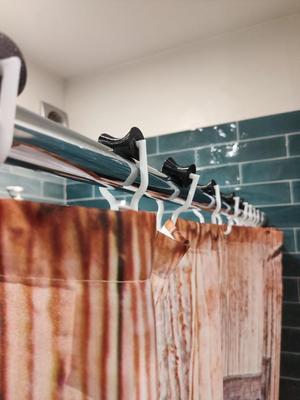 Shower curtain holder