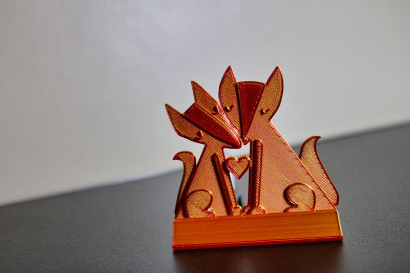 Whimsical 3D Printed Foxes Holding Heart
