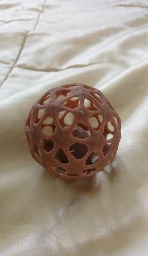 Mesh ball with captive sphere 