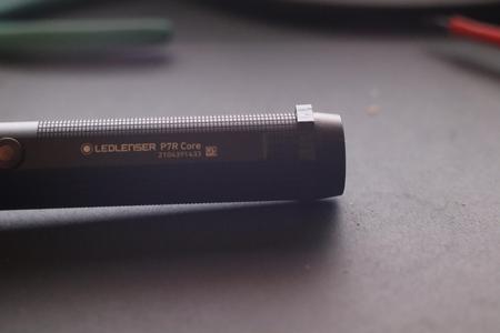Flashlight anti roll protection ring
