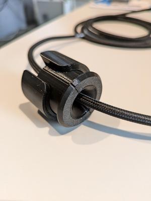 Parametric cable passthrough with strain relief