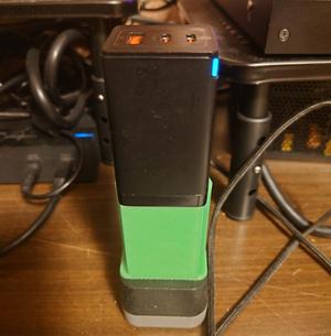 Anti-wobble shroud for European to US wall outlet adapter